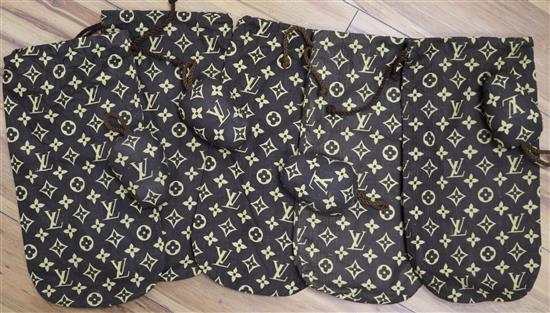 Five Louis Vuitton printed cotton shoe bags and two pairs of Louis Vuitton fabric shoe trees, c ...
