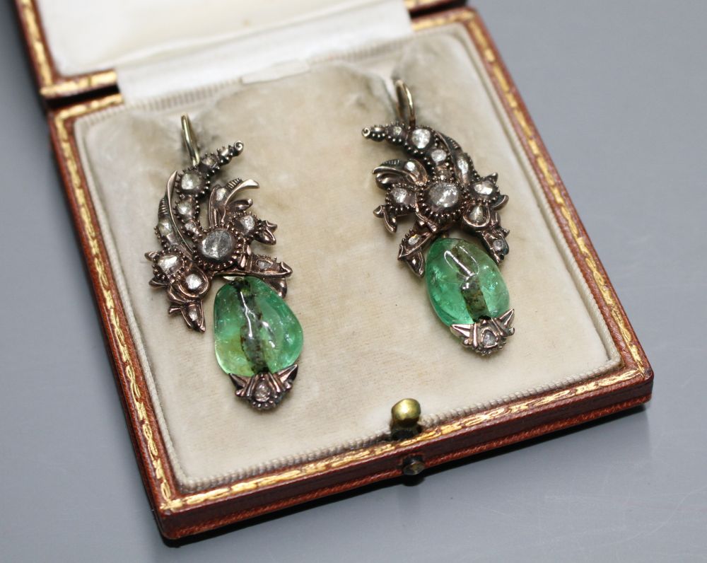 A pair of antique yellow metal, emerald and rose cut diamond set foliate earrings, with GCS certificate dated 14/02/20. A pair of antique yellow metal, emerald and rose cut diamond set foliate earrings, with GCS certificate dated 14/02/20.