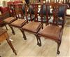 A set of four Chippendale style chairs with plain upholstered seats on cabriole legs with claw and ball feet                           