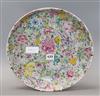 A Chinese famille rose 'thousand flower' pattern dish, Republic period with Qianlong mark, diameter 33cm (a.f.)                        