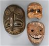 A North West American mask and two Asian masks Largest length 28.5cm                                                                   