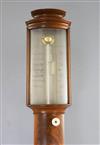 G. Lowe of Gloucester. A Regency flame mahogany bowfront stick barometer, 39in.                                                        