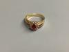 A modern 14 K yellow metal, ruby and diamond cluster ring, size M, gross 3.9 g.                                                                                                                                             