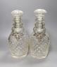 A pair of cut glass decanters with stoppers and Victorian silver ‘sherry’ and ‘claret’ labels, Reily & Storer, London, 1844, - 27.5cm high                                                                                  