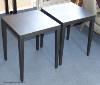 A pair of ebonised lamp tables, 45 cm wide, 55 cm high                                                                                                                                                                      