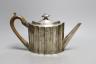 A George III engraved silver oval 'batwing' shaped teapot, George Smith II, London, 1788, gross weight 14.5oz.                                                                                                              