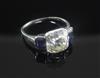 An impressive 1920's/1930's platinum and three stone diamond and sapphire ring, size O.