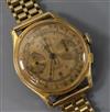 A gentleman's 18ct gold chronograph manual wind wrist watch on a 9ct gold bracelet.                                                    