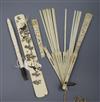 A Japanese ivory page turner, ivory umbrella handle and fan                                                                            