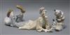 A Lladro clown reclining and Lladro clown with concertina and dog                                                                      