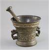 An early 17th century Dutch bronze mortar, diameter 5.75in., height 5in., with a pestle                                                