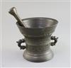 An early 17th century Dutch bronze mortar, diameter 6.25in., height 5.5in. with an associated pestle                                   