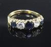 An 18ct gold, sapphire and diamond five stone half hoop ring, size Q.                                                                  