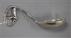 A 1920's Danish Georg Jensen sterling silver blossom pattern sauce ladle, no. 141, 17.2cm.                                             