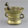 An early 17th century Dutch or German bronze mortar, diameter 7.5in. height 5.5in., with an associated pestle                          