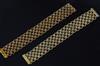 A near pair of early 1970's import marked textured 18ct gold 'knot link' bracelets,                                                    