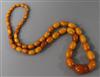 A single strand graduated amber bead necklace, gross weight 34 grams, 60cm.                                                            