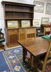 An oak dining suite, comprising dresser, dining table and a set of six chairs                                                          