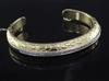 A 1980's Italian Gucci 18ct gold and diamond set 'crocodillo' open bangle,                                                             