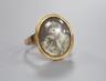 An early 19th century yellow metal ring inset with ivory? panel of a young lady                                                                                                                                             
