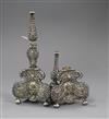 A pair of filligree white metal and red stone set candlestick? bases (a.f.), 17.4cm.                                                   