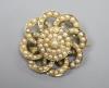 An early 20th century yellow metal and seed pearl set circular cluster brooch, 27mm                                                                                                                                         