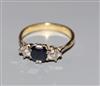 An 18ct and plat, sapphire and diamond set three stone ring, size S.                                                                   