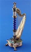 A good late 19th century Viennese silver and polychrome enamel timepiece modelled as a harp, by Hermann Bohm, 6.25in.