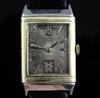 A 1930's 18ct gold and stainless steel Le Coultre Reverso manual wind wrist watch,                                                     