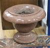 A pair of pink granite urns W.45cm                                                                                                     