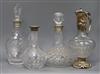 Three cut glass decanters with silver collars (one stopper deficient) and plate-mounted cut glass claret jug                           