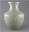 A Chinese celadon glazed archaistic moulded vase, Qianlong underglaze blue seal mark to base, probably 19th century, H.30cm            