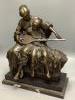 A 20th century cold cast bronze resin figure group of a mother and daughter playing an instrument, height 50cm                                                                                                              