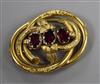 A Victorian pinchbeck and paste set scrolling brooch, 51mm.                                                                            