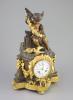 A large French figural bronze and ormolu mantel clock, 19th century 46cm high.                                                                                                                                              