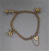 A 9ct gold charm bracelet, hung with three assorted 9ct gold charms.                                                                   