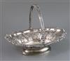 A George IV embossed silver swing-handled cake basket, James Kirby & Joseph Waterhouse, 37 oz.                                         