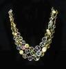 A modern Italian gold and graduated multi gem set three row spectacle necklace by Marco Bicego                                                                                                                              