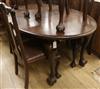 A 1920's mahogany oval topped extending dining table W.150cm                                                                           