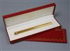 A gold plated Must de Cartier pen in box with certificate.                                                                             