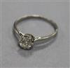 A platinum and solitaire round cut diamond ring, size L.                                                                               