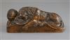 A late 18th century wood carving of a lion recumbent upon military trophies, 9.25in.                                                   