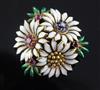 An 18ct gold, two colour enamel and multi gem set flower head brooch, 33mm.                                                            