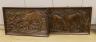 A pair of 1930's carved oak panels of deer grazing, 84 cms wide x 52 cms high.                                                                                                                                              