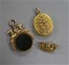 A Victorian 9ct gold and carnelian set spinning fob seal, a 9ct coronet brooch and a yellow metal locket.                              