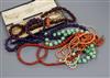 Assorted necklaces including coral and amethyst, a carved coral pendant and a pair of folding lorgnettes.                              