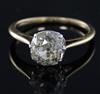 A gold and old mine cut solitaire diamond ring, size O/P.                                                                              