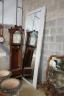 A large rectangular bevelled wall mirror with suede and chrome border, width 110cm, height 280cm                                                                                                                            
