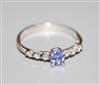 A modern 18ct white gold, tanzanite and diamond dress ring, size O.                                                                    