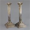 A pair of 1960's silver corinthian column candlesticks,                                                                                